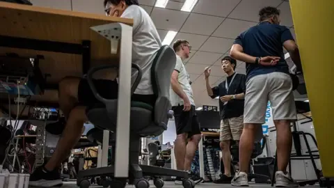 Tokyo urges men to wear shorts to work, but women say it’s ‘leg hair harassment’
