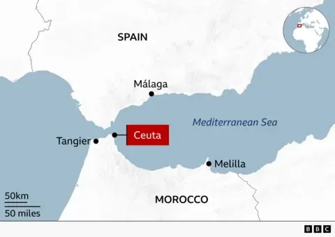 Hundreds of migrants swim from Morocco to Spanish enclave of Ceuta