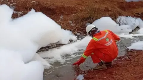 Mysterious white foam draws crowds on Nigerian highway
