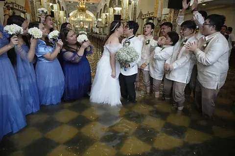 ‘It’s love in the middle of a disaster’: The couple who married in typhoon floods